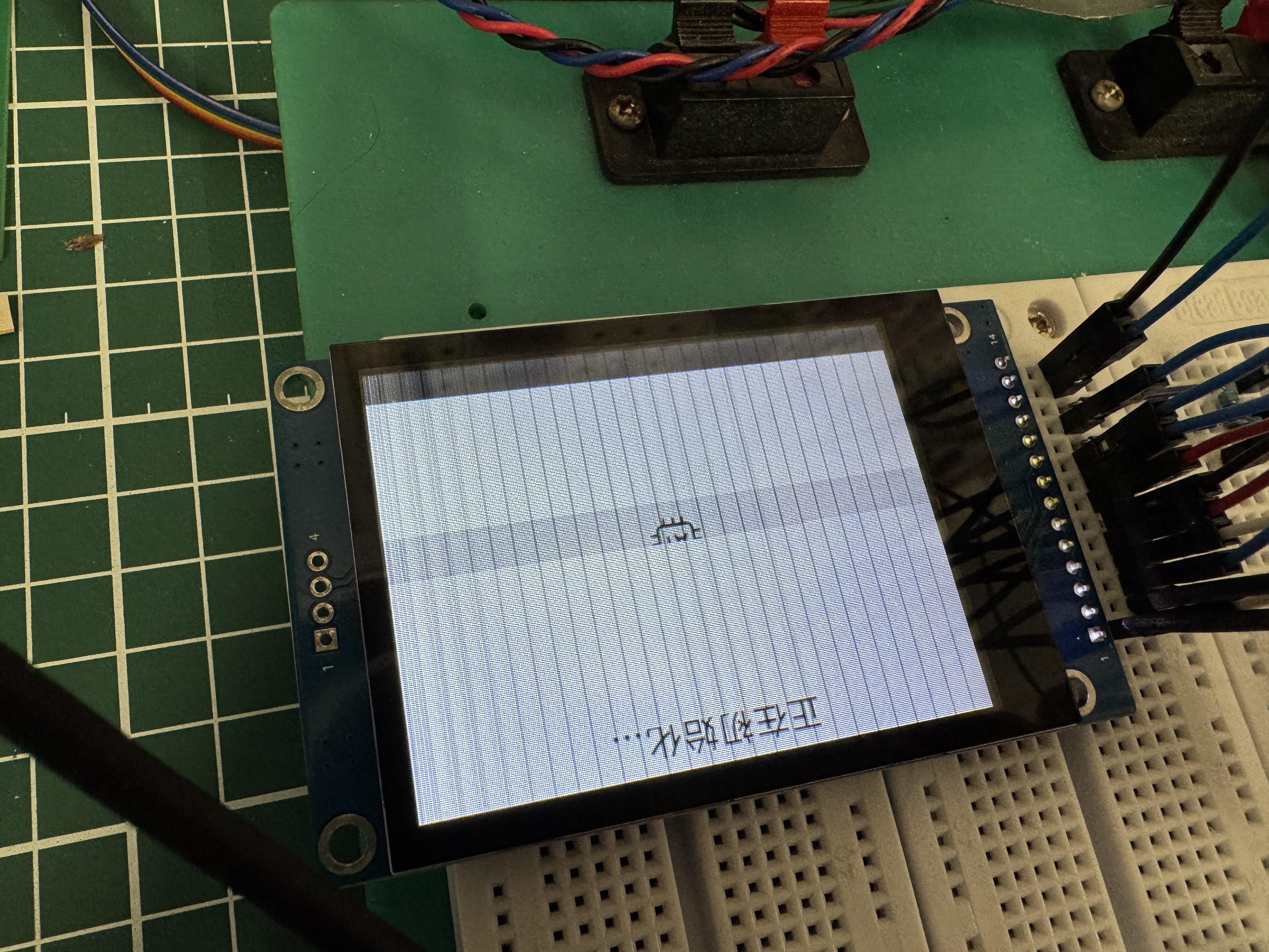 TFT showing vertical line artifacts; caption notes I2C communication suspected and wiring was adjusted