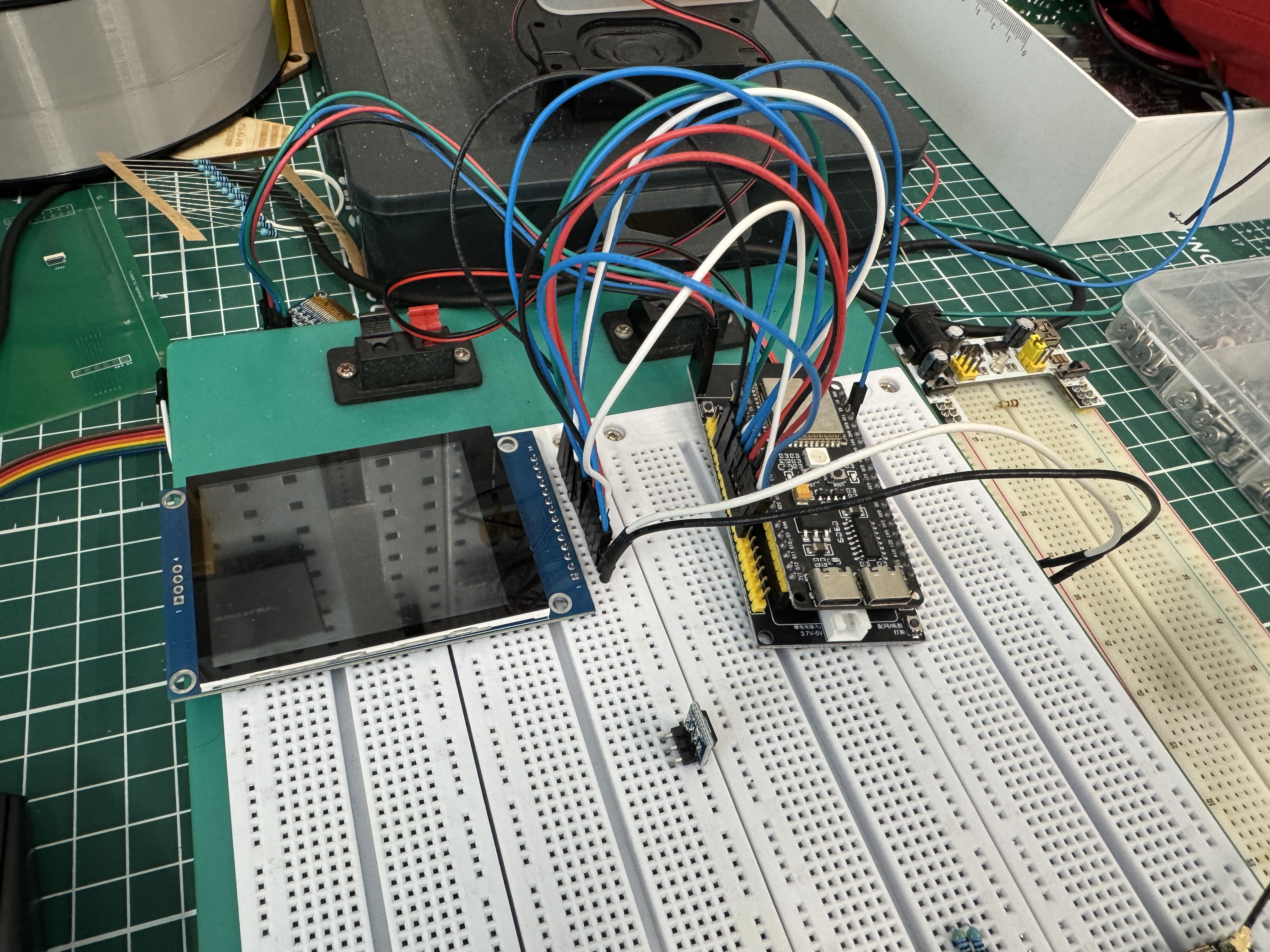 Breadboard with XiaoZhi voice module connected alongside ESP32 display and hub boards