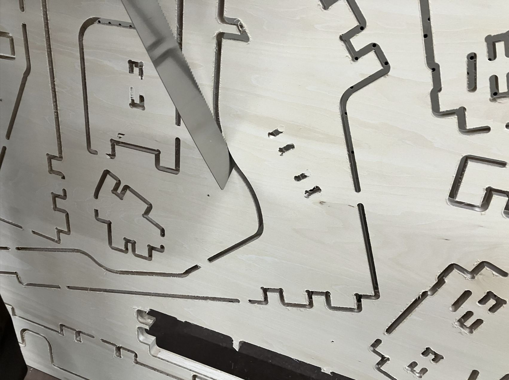 sawing to separate parts from the board