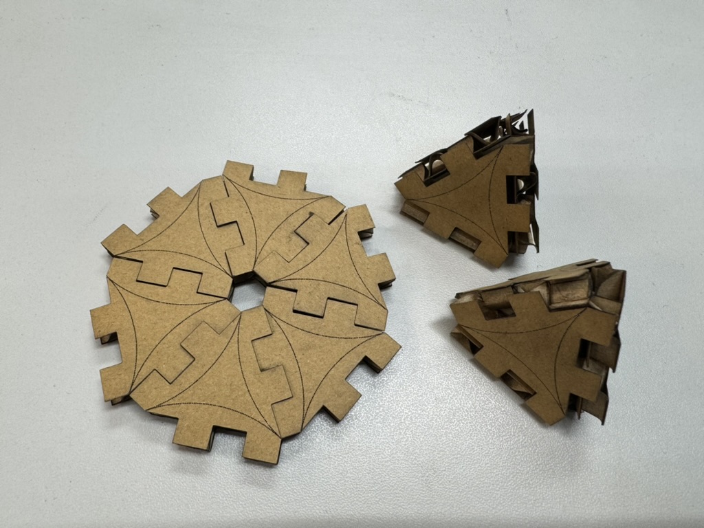 Finished press-fit pieces cut from cardboard