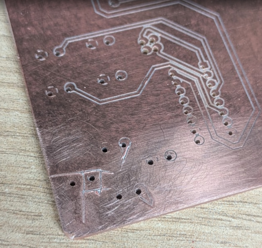 The Carvera has autolevelling by using a probe in 25 spots on the board - so please tell me why it didn't mill through the copper on just the bottom right corner - you'll see here my attempt at a fix - just knifing through it - you can tell I'm running out of steam here.