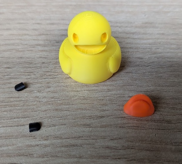 Here is my better way to approach multi coloured prints. Cut out the different parts of your design and print them separately - then you can neatly slide them into each other and add a touch of glue to keep them secure. Saves so much filament!