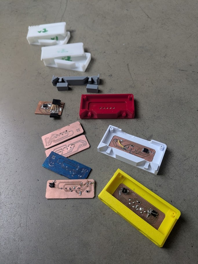 The many iterations of the cartrdige itself and it's embedded PCB meant to interface with the slot via pogo pins