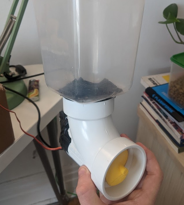 and paired it with some standard 2 inch PVC piping and a plastic tub I cut a hole in the bottom