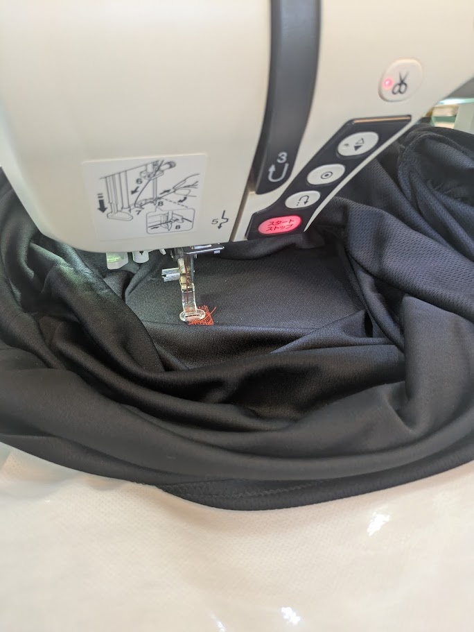 Takes a bit of patience to get the shirt properly attached and aligned to the backing and into the hoop and aligned with the machine