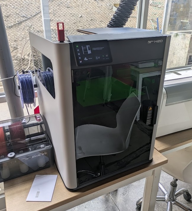 Bambu Labs H2D - Jorge's new toy in the FabLab - this thing does *too* much. In addition to being a full fledged 3D printer with multifilament support - it also boasts a slightly weaker 40W laser - but do not be fooled - this thing can cut! The bed size is slightly smaller at 310mm by 250mm but it can move a heck of a lot quicker to get the same cutting (50-100mm/s) and engraving (800-1000mm/s) jobs done. The kerf on this machine is noticeably smaller likely due to the higher precision components and self calibration features. I found it to cut about 0.14mm +/- 0.02mm of the material. One notable difference here is that the H2D cannot work with transparent materials due to the type of blue light laser used.