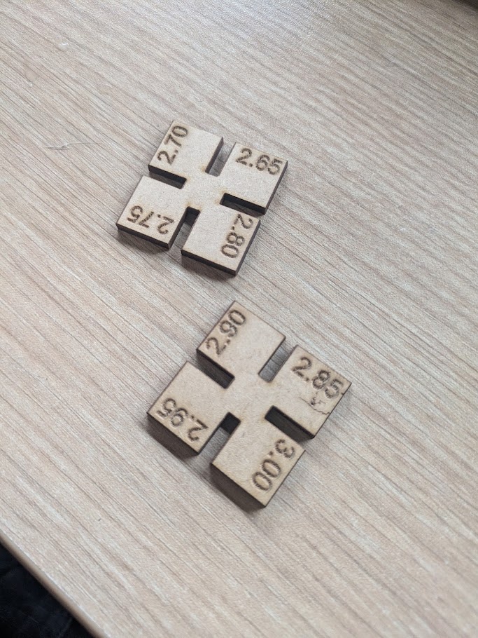 The material was about 3.00mm in thickness so the kerf test tokens are all under that to see what fit is best (since we want a friction hold)