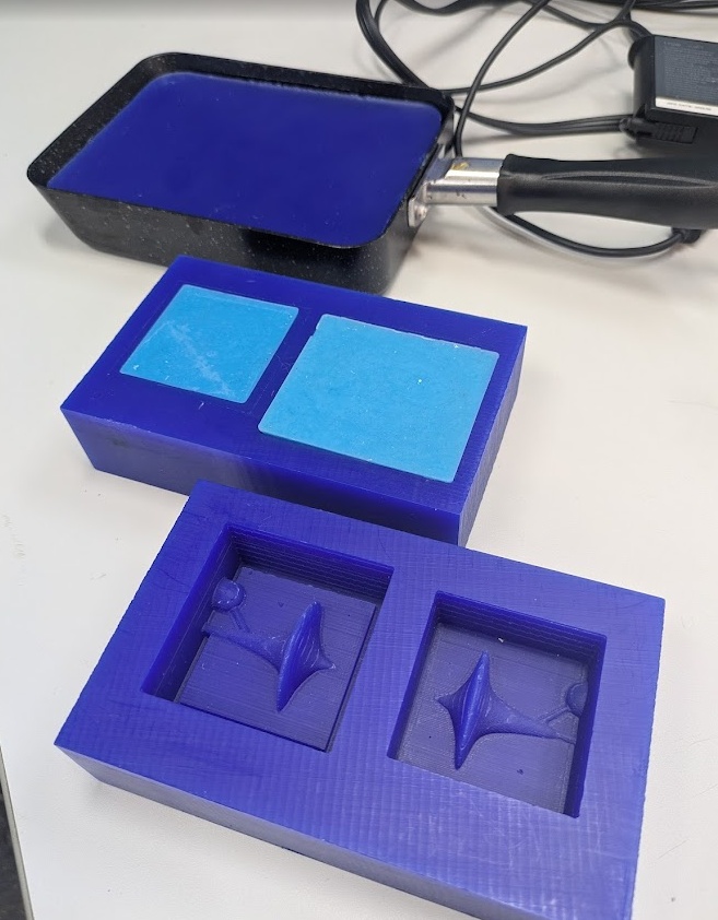 Showcasing Yuichi's recycling process, taking old bits collected from previous milling work, and then remelting them in the perfectly shaped tamagoyaki pan! The second block contains a silicone mold made by a student in a previous cycle. The third mold contains the 