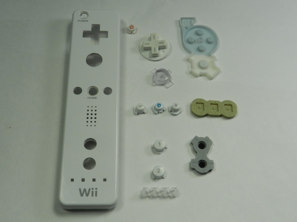 This assembly is so much more complex than you would first think. The plastic buttons (or D-pad) sit on top of the membranes, which get slotted into a keyway/guide on the underside of the plastic housing of the controller which you can't see in this picture. It's a lot to wrap your head around when you're CADing it from scratch!