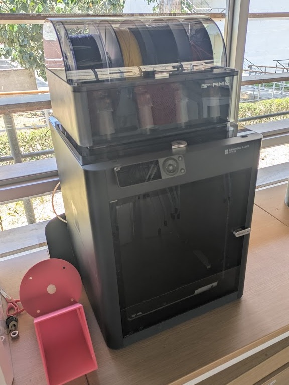 Bambu P1S with AMS. FDM. Build Volume: 256mm x 256mm x 256mm. Max speed: 500mm/s. Closed enclosure. Obsolete machine now!