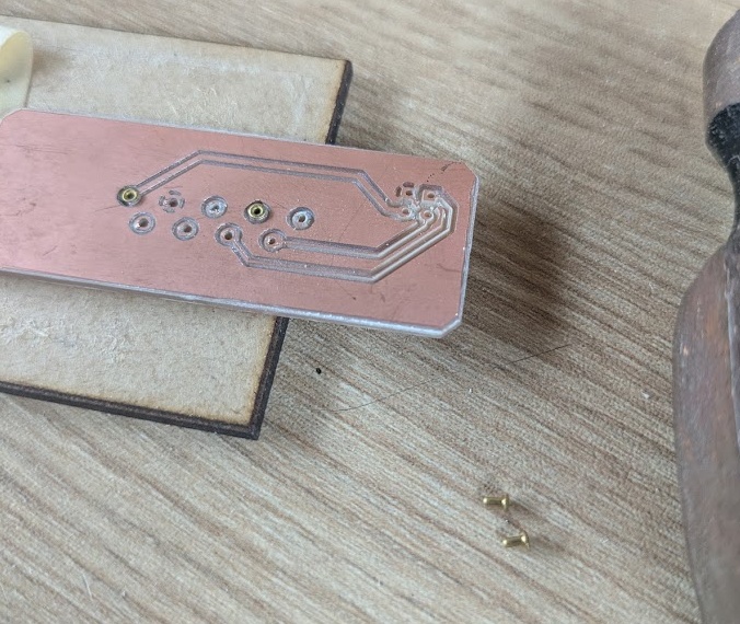 1mm rivets you can hammer into the board