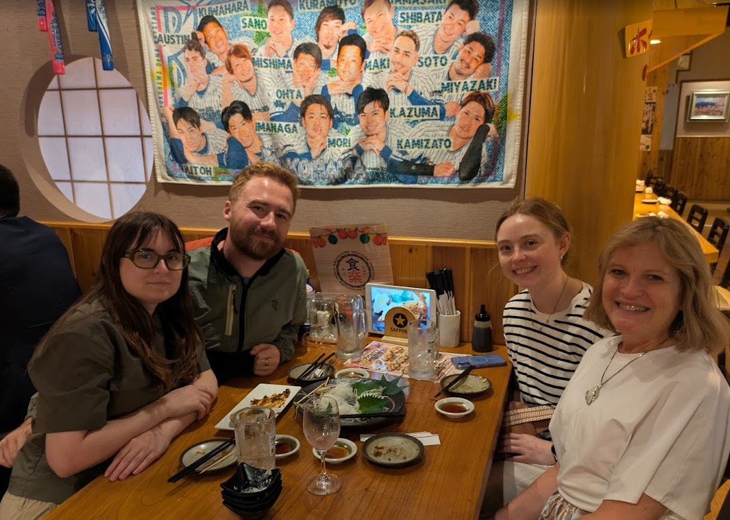 My wife and my mother and sister-in-law having dinner in Yokohama with the precious Yokohama BayStars baseball team posing behind us on a commemorative towel