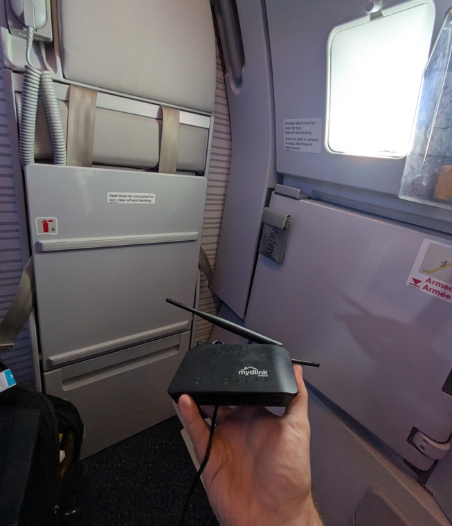 I wonder my seatmates were thinking when I pulled out this router halfway through the flight and plugged it in under the seat