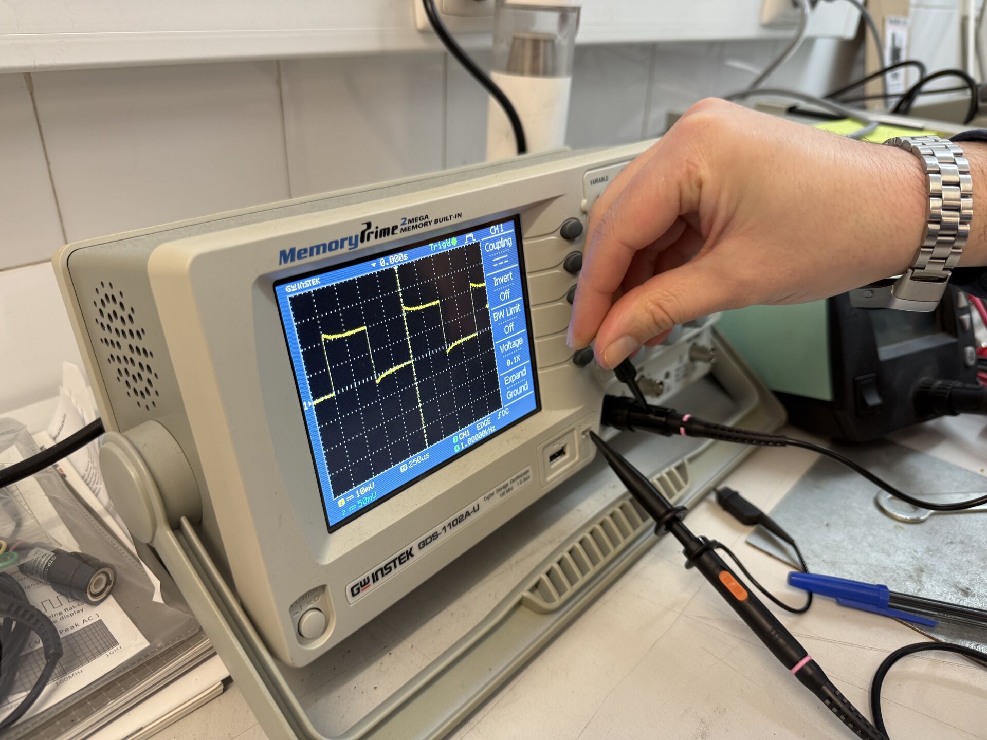 Close-up of oscilloscope screen — square wave