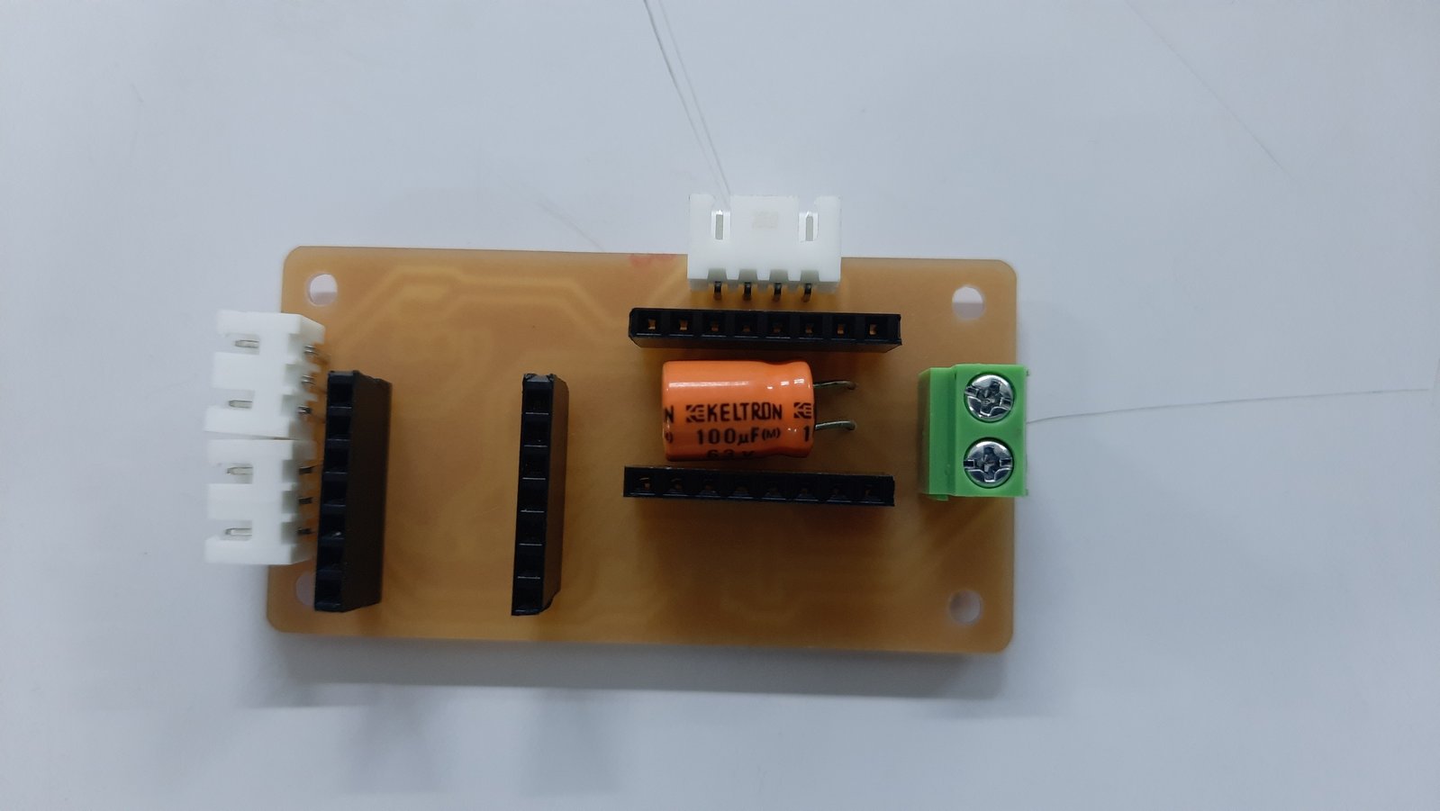 The through hole components are soldered on the back so the pins can be soldered on the front side.