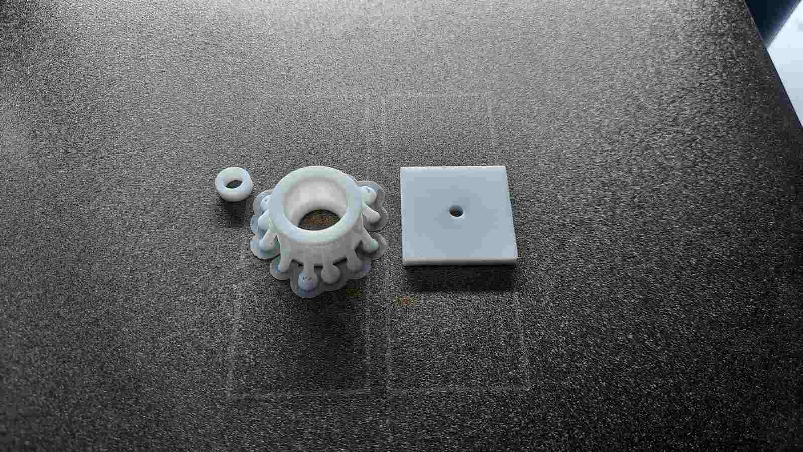 A trial bearing assembly created to evaluate how the bearing holder would be mounted and supported on the slider mechanism.