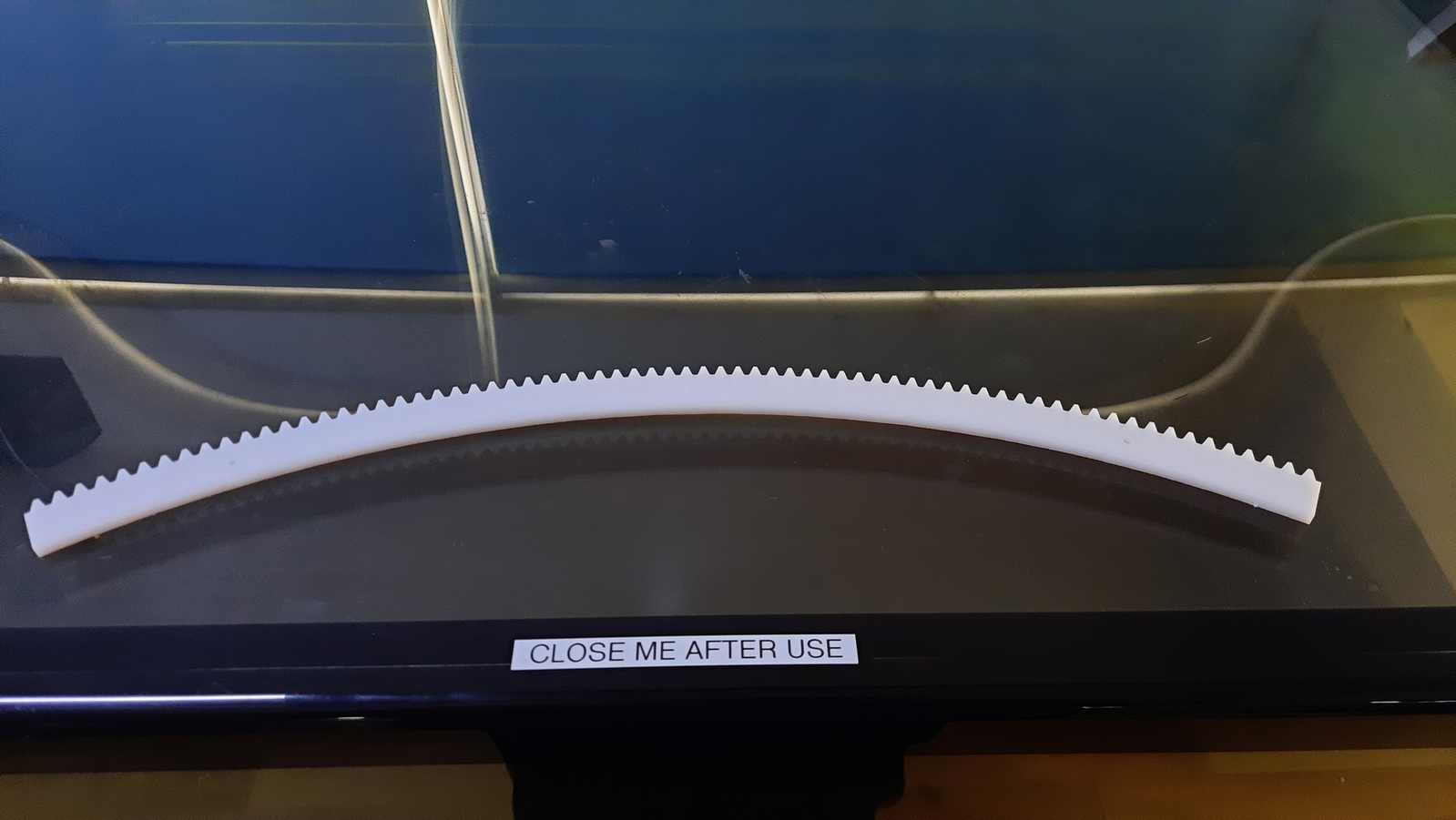 The finished acrylic gear had clean edges and was easily removed from the sheet after cutting. A 6 mm white acrylic sheet was used to provide rigidity and stability.