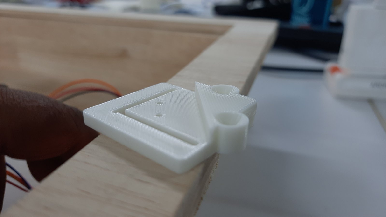 A 3D printed holder designed to securely mount the JST breakout board. The holder keeps the PCB in position and provides support during assembly.
