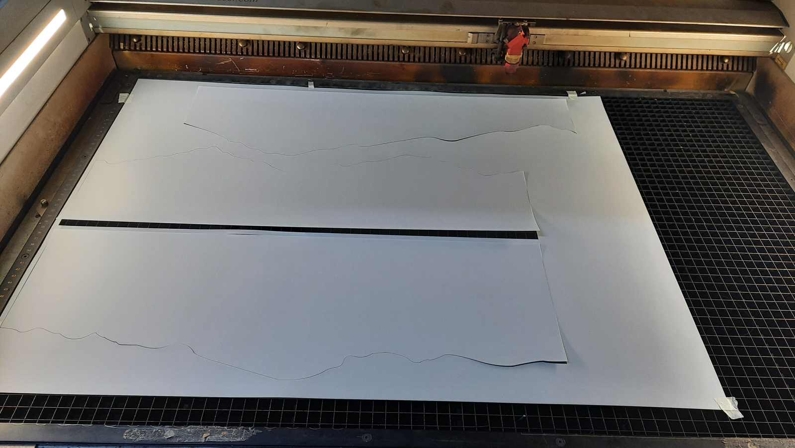 The image layers were laser cut using synthetic paper. The individual layers could then be stacked together to recreate the artwork.