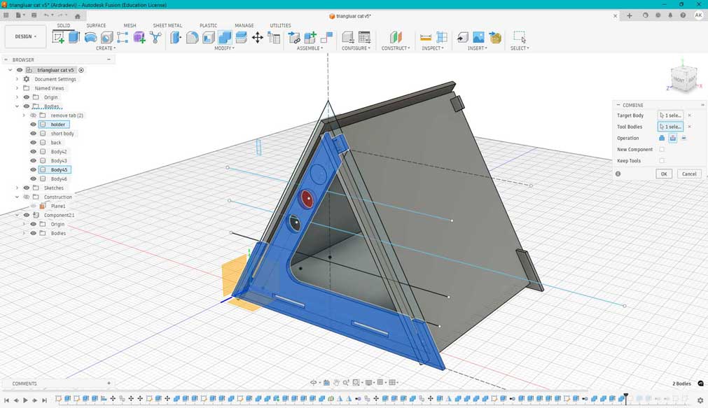 Go to Modify → Combine. Select the target body (the body to be perforated), and then select the tool body. There can be more than one tool body.