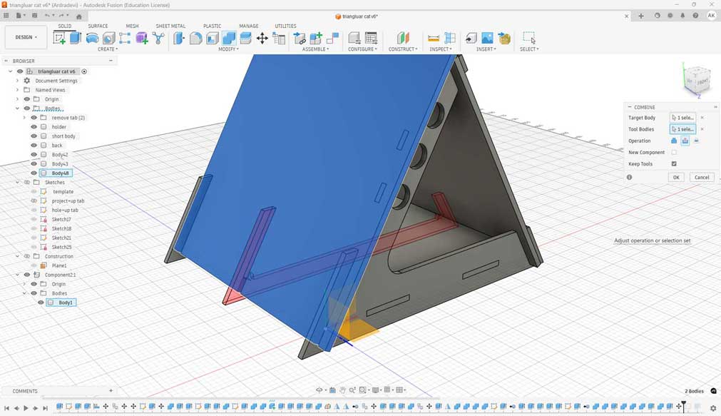 Go to Modify → Combine. Select the target body (the body to be perforated), and then select the tool body. There can be more than one tool body.
