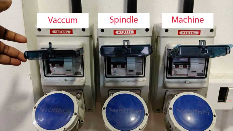 These are the switches to be flipped up to turn on different parts of the machine. The machine is turned on first, then the axes are set. The spindle and vacuum are turned on only after this.