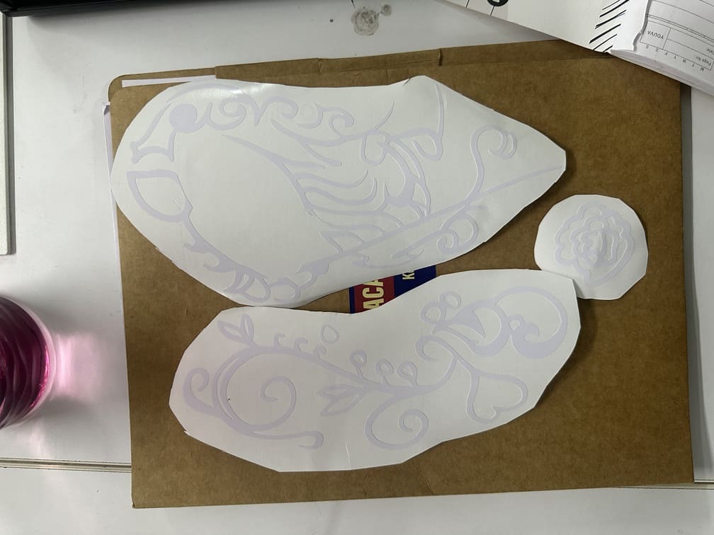 Weeding excess vinyl using tweezers