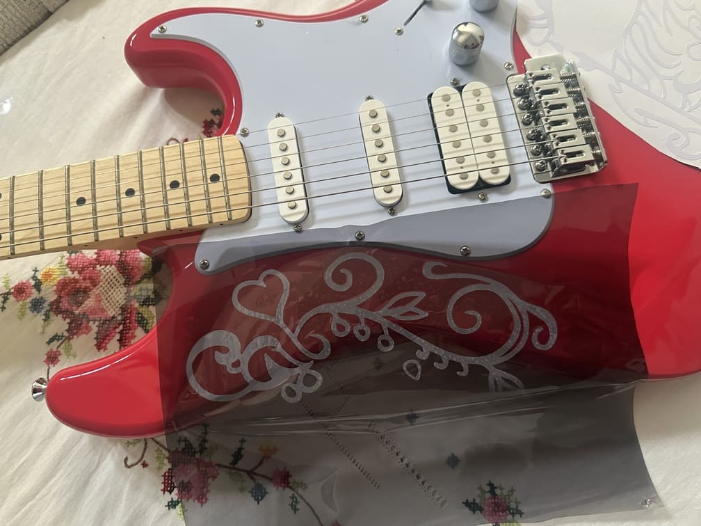 Applying vinyl to guitar using transfer paper