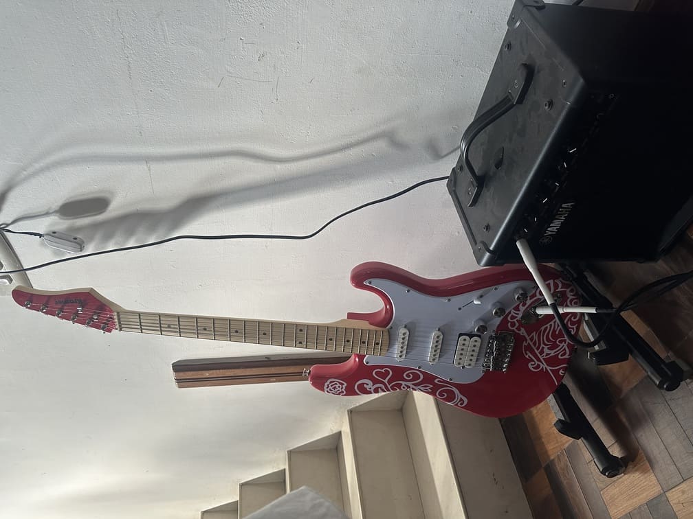 Final vinyl design applied on guitar body