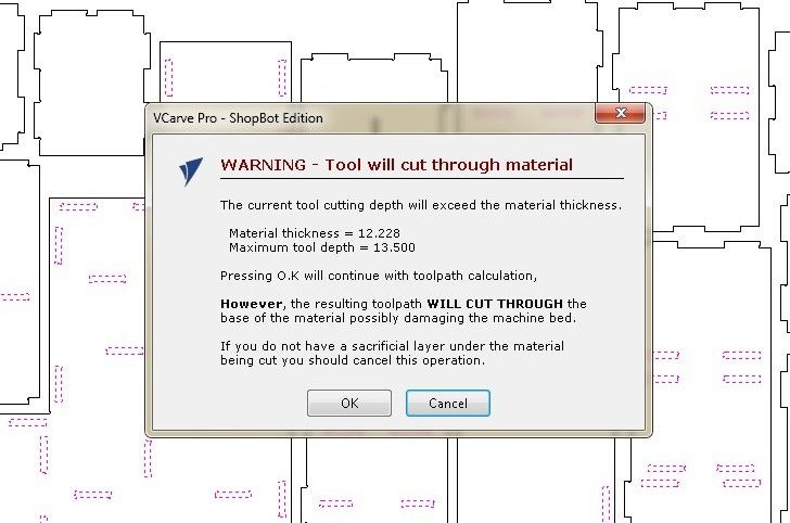 VCarve Pro ShopBot Edition warning dialog: 'Tool will cut through material', material thickness 12.228mm, maximum tool depth 13.500mm, advising to confirm a sacrificial layer exists under the material before proceeding