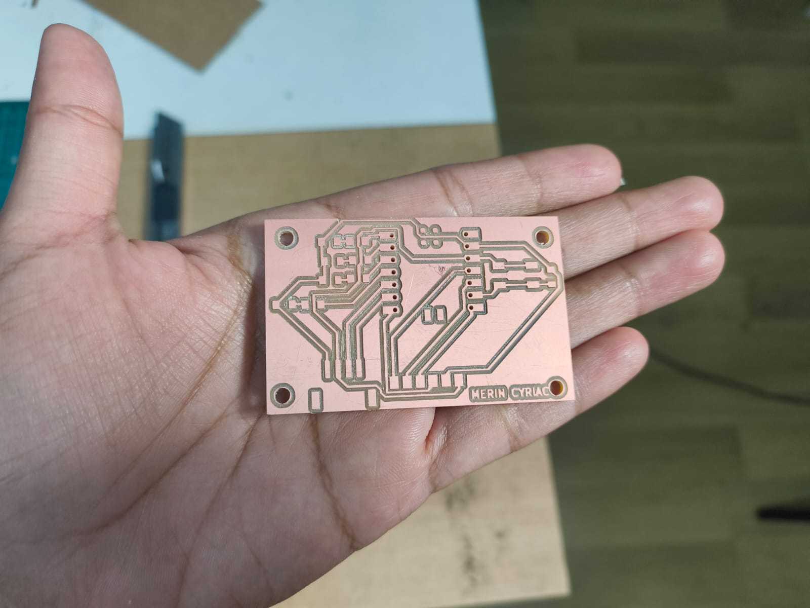 Completed milled PCB with traces isolated, holes drilled, and board outline cut