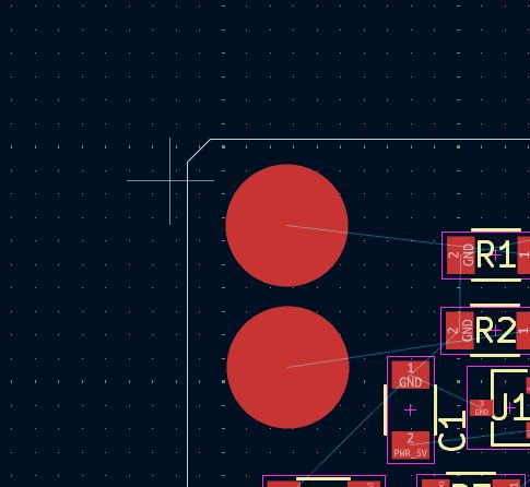 KiCad PCB editor close-up of the two filled copper capacitive touch pads with R1 and R2 pulldown resistors and J1 connector visible on the right