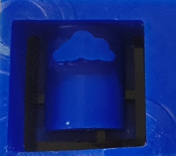 Outer acrylic frame holding the silicone mold after pouring, left to cure