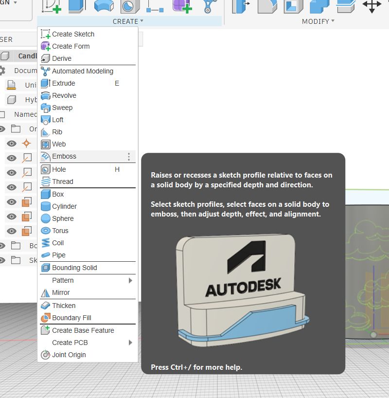 Fusion 360 Emboss tool selected in the Create menu