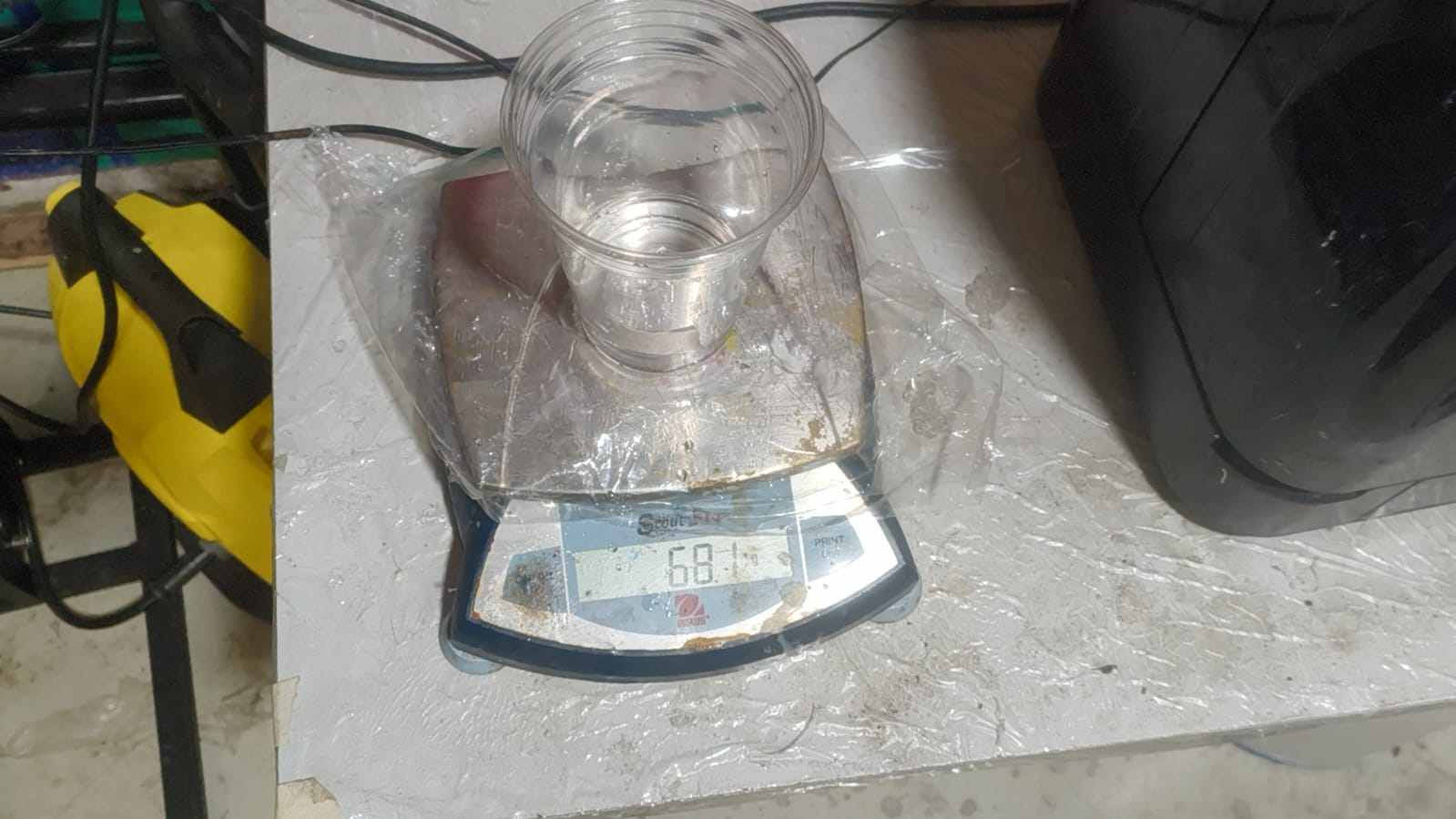 Water poured into the acrylic-framed mold to measure volume before silicone casting