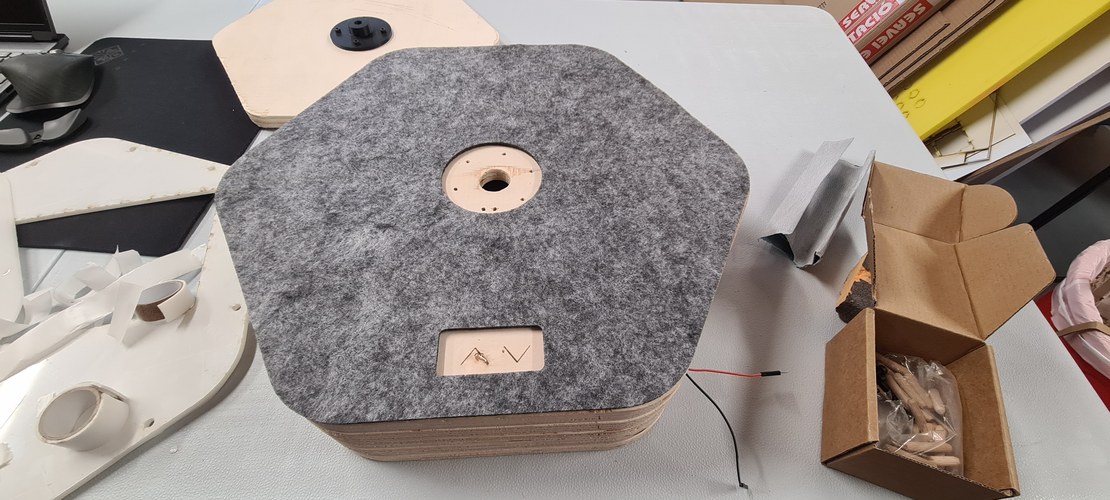 The grey felt laid over the base stack, with the central hole and the arrow window cut into it.