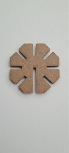 A single laser-cut press-fit module: an octagon with seven identical slots and one deeper slot, in cardboard.