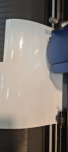 White vinyl loaded under the blade carriage of the Roland GX-24.