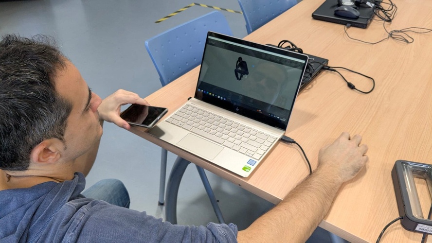 Reviewing a Ferret scan result on the laptop screen.