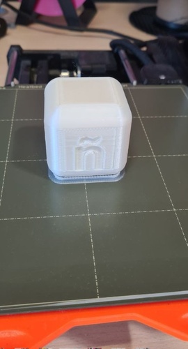 First print of the ñ cube on the Prusa Mini bed, white PLA.
