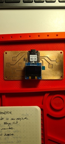 Qpad board with XIAO RP2040 mounted, showing the header pins and OLED display connector.