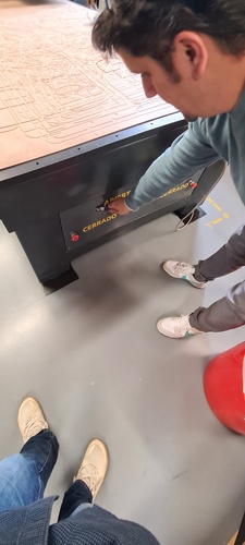 Someone activating one of the three vacuum zone switches on the front panel of the TEC-CAM 500.