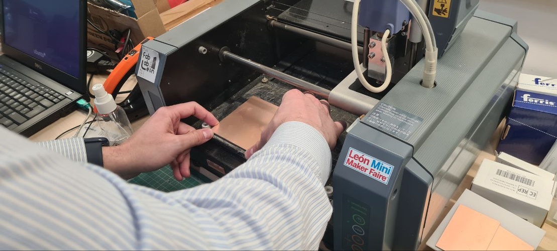 Close-up of FR1 board corner mounted on MDX-20 sacrificial board, board edge flush against the corner stop.