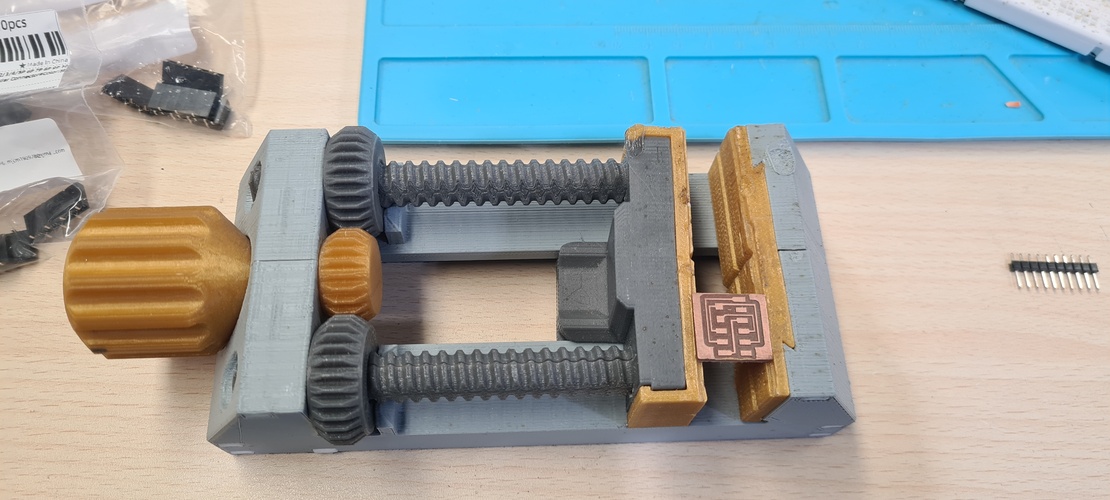 XIAO RP2040 inserted into breadboard with pin headers alongside for alignment reference.