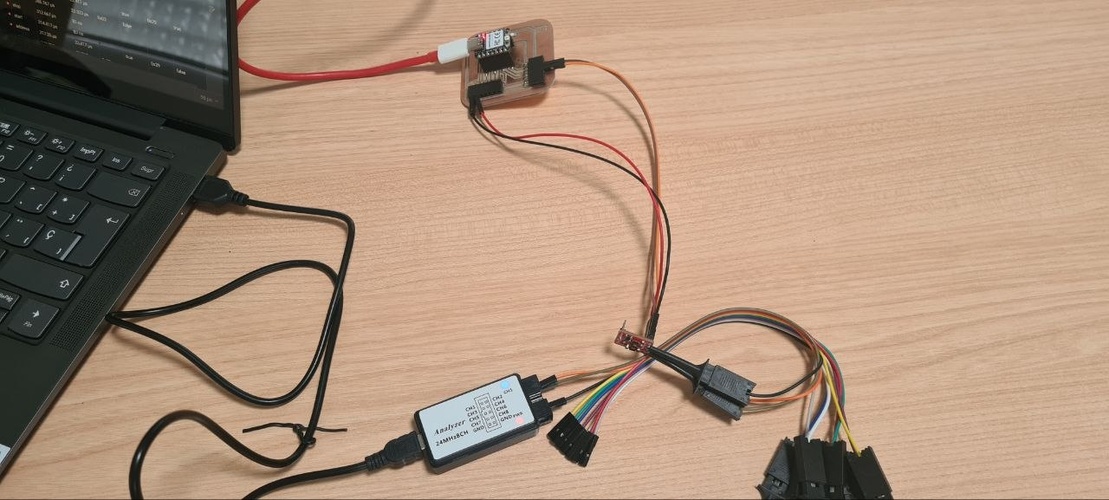 Full bench setup showing the laptop, logic analyzer, XIAO RP2040 board and VL53LXX breakout all connected together on a desk.