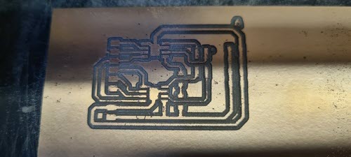 Close-up of the freshly milled PCB showing copper traces for the dual A4950 stepper driver board. The routing shows wide power traces around the perimeter and finer signal traces in the centre.