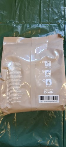 Back of the Algaplay Michelangelo Casting Plaster bag, showing the three-step pictogram: 1) 1000 g of powder, 2) 300 ml of water, 3) stir for 2 min. Setting time stated as 15 min.
