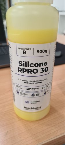 Close-up of the yellow Hardener B bottle of Reschimica RPRO 30 with its label