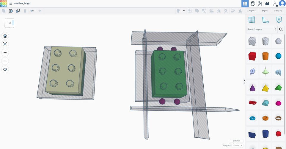 Top view in Tinkercad while building the mould. The brick (imported from Fusion as STL) sits centred in the workplane, surrounded by hole primitives that will carve the inclined outer walls and the alignment pegs.