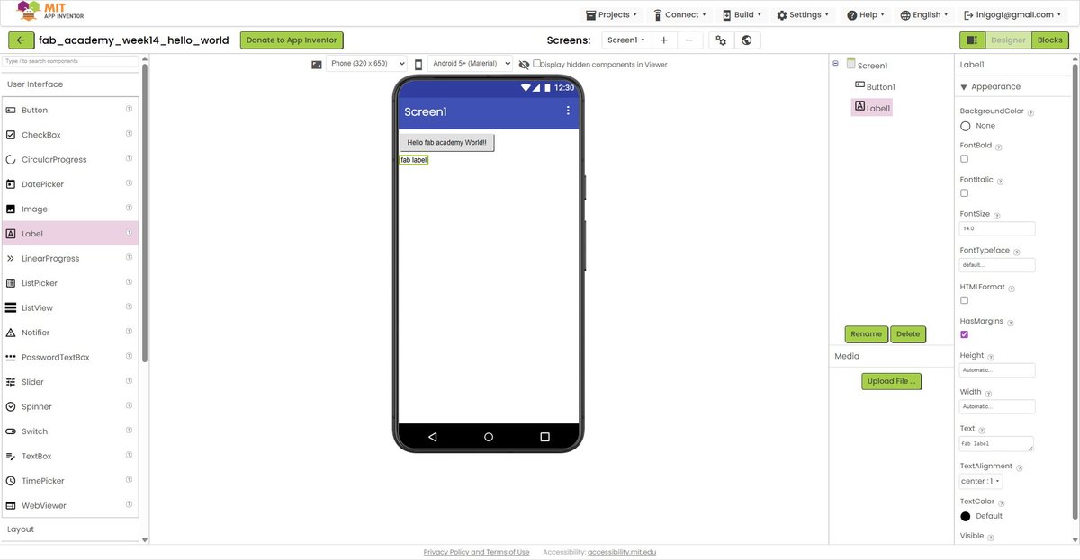 App Inventor Designer mode. Left pane shows the User Interface palette (Button, CheckBox, Label, etc.). Centre shows a phone-shaped canvas with a Button reading 'Hello fab academy World!!' and below it a Label reading 'fab label'. Right pane shows component tree (Screen1 → Button1, Label1) and the property editor for Label1.